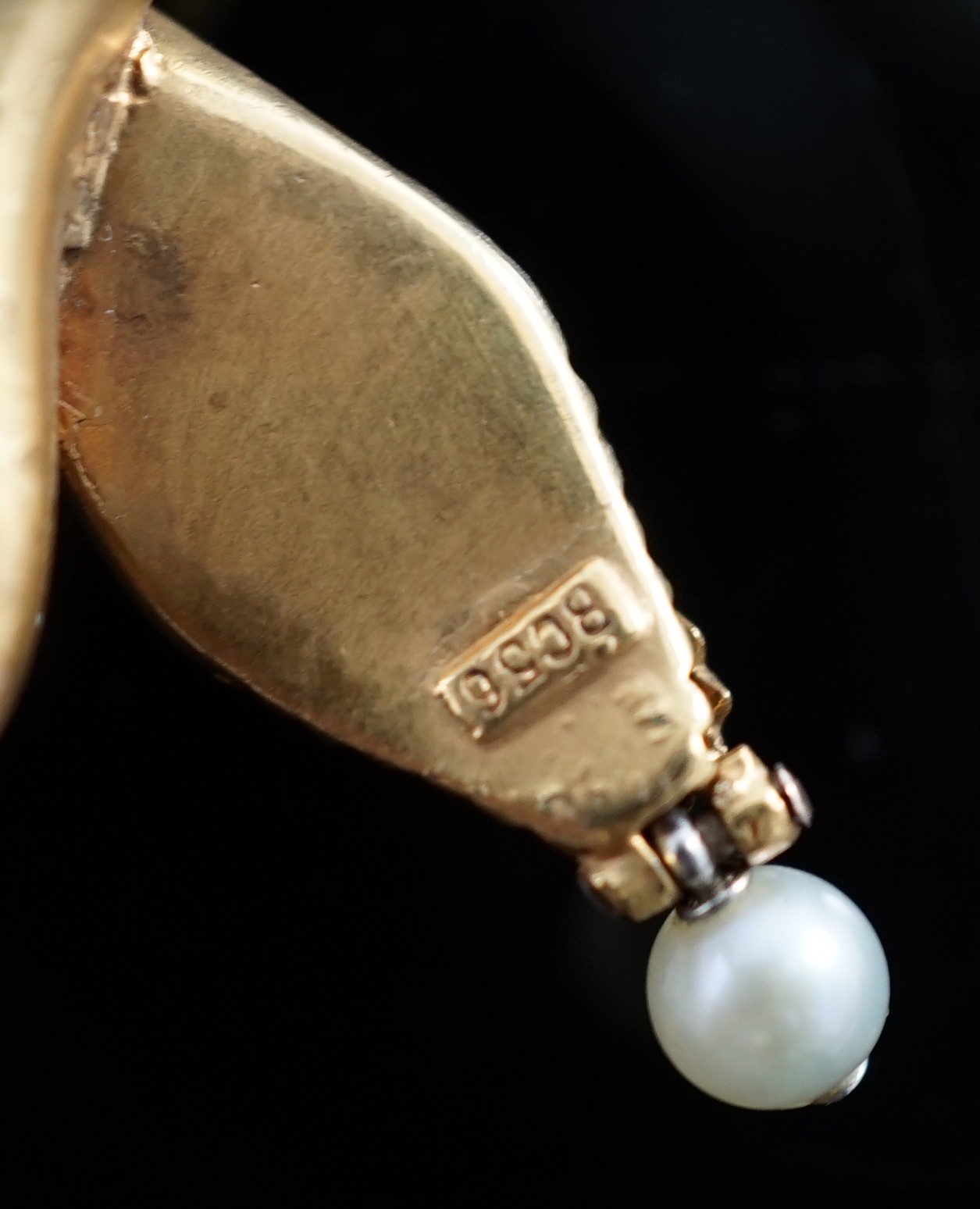 An early 20th century multi-strand gold, emerald, rose cut diamond and cultured pearl drop set twin headed serpent necklace